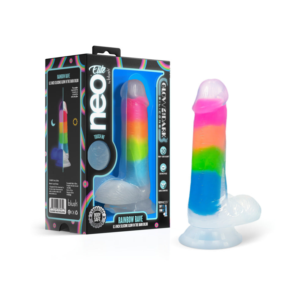 Neo Elite Glow-in-the-Dark Rainbow Rave 6.5 in. Silicone Dual Density Dildo Blush Neo Elite Rainbow Rave dildo rainbow shaft beside black window box