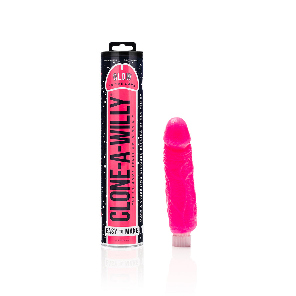 Clone-A-Willy DIY Vibrating Dildo Kit Glow-in-the-Dark Hot Pink Clone-A-Willy Hot Pink Vibrating Kit hot pink molded vibrator beside black pink canister