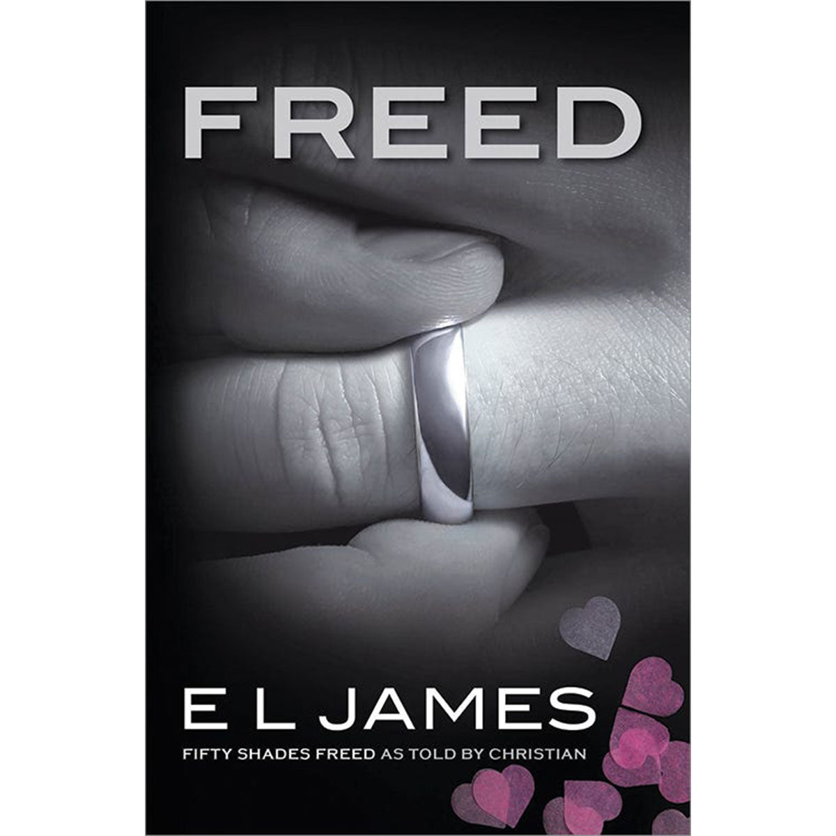 FREED: 50 Shades Freed As Told By Christian Freed by E L James paperback book with black cover and grayscale kissing couple