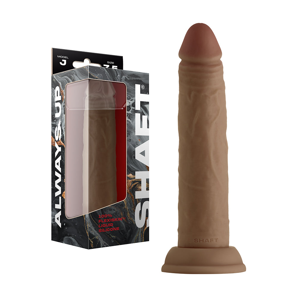 Shaft Model J: 7.5 in. Dual Density Silicone Dildo Oak Shaft Model J 7.5-inch oak dildo beside windowed retail box