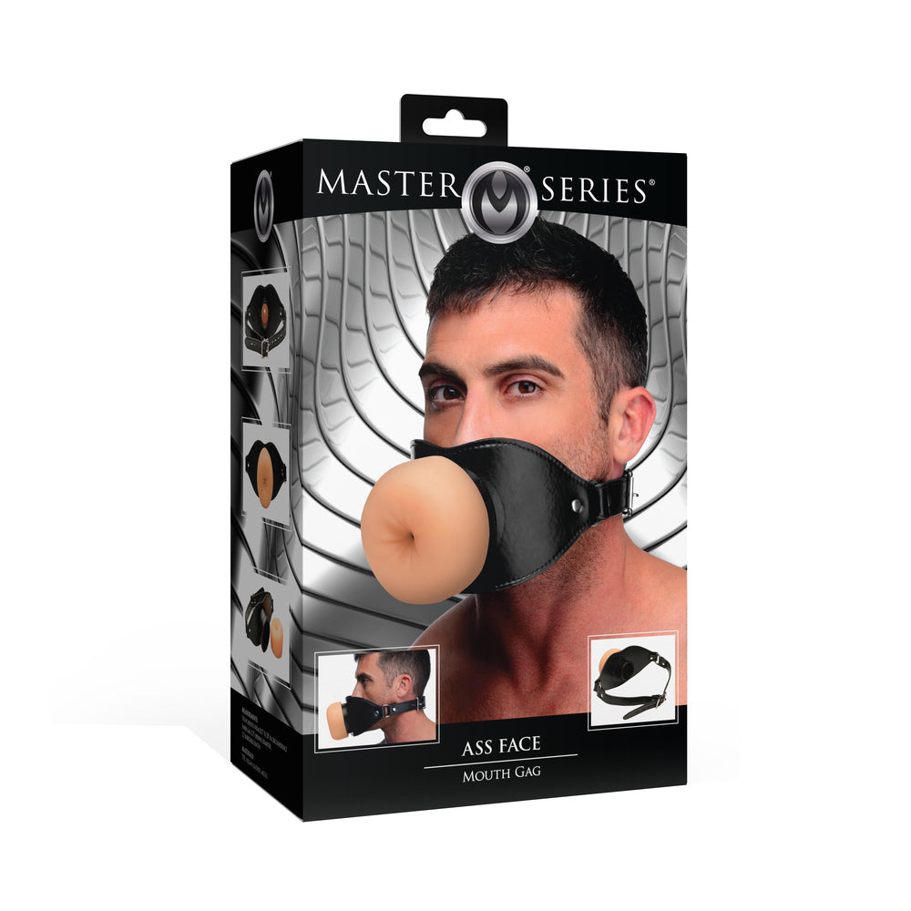 Master Series Ass Face Mouth Gag Master Series Ass Face beige TPE mouth gag worn by model beside black retail box