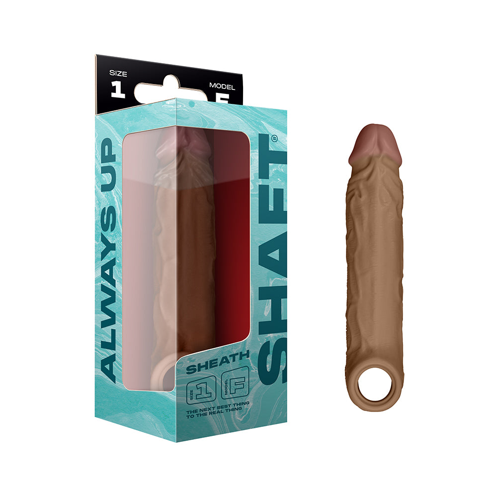 Shaft Model F: Sheath Oak Size 1 Oak Size 1 Shaft Model F light brown silicone sheath with ringed base beside box
