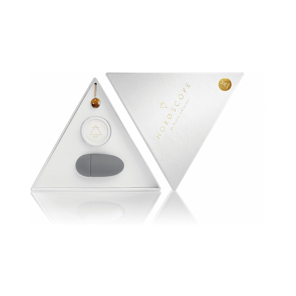 Bijoux Indiscrets Horoscope Kit Gemini open white triangular Gemini Horoscope kit with orange stone necklace balm and gray vibrator