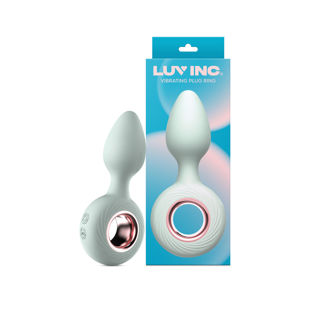 Luv Inc Vr14: Plug Ring Vibe Green aqua Luv Inc VR14 plug ring vibrator beside its teal gradient retail box