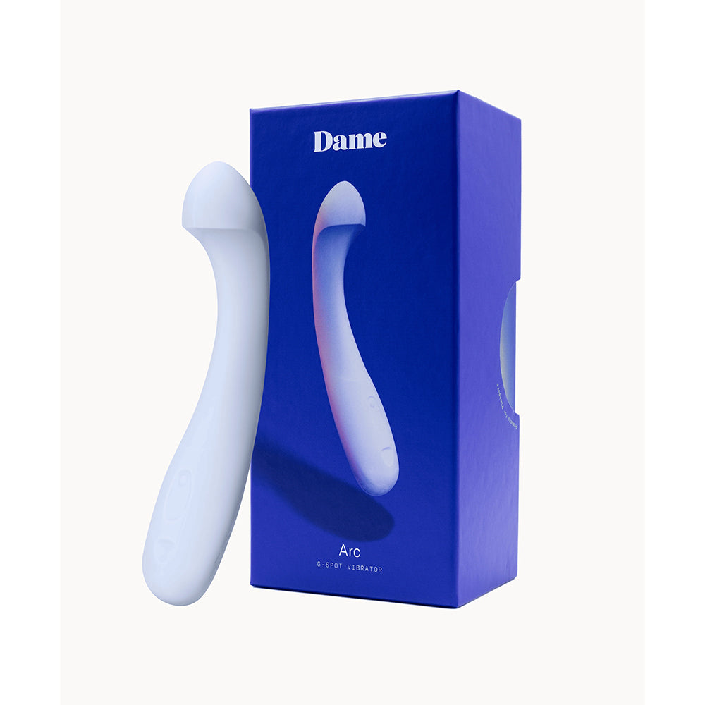 Dame Arc G-Spot Vibrator Ice Ice-blue Dame Arc vibrator beside blue retail box