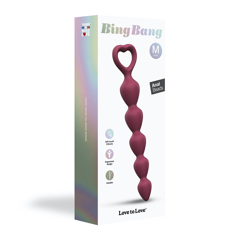 Love to Love Bing Bang Silicone Anal Beads Prune Medium Prune medium Bing Bang seven-bead strand beside tall retail box