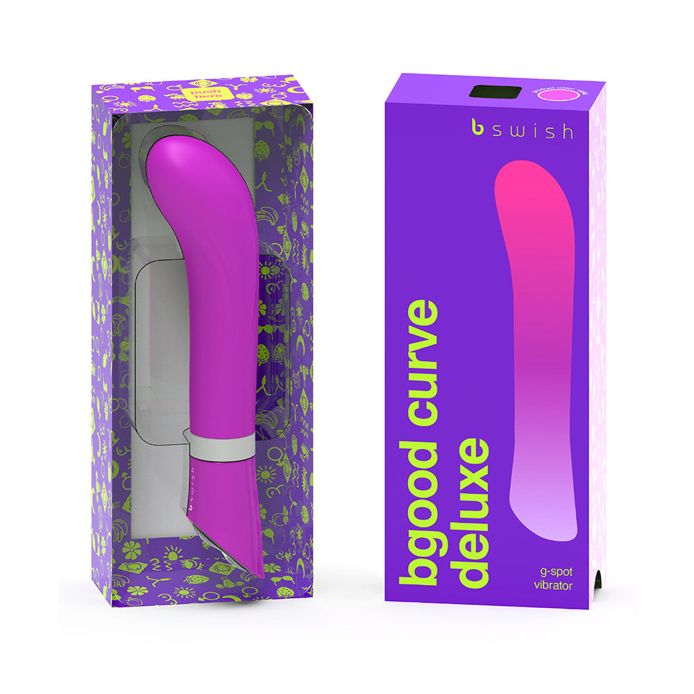 B Swish Bgood Deluxe Curve Vibrator Violet violet B Swish Bgood Deluxe Curve vibrator beside its purple window box