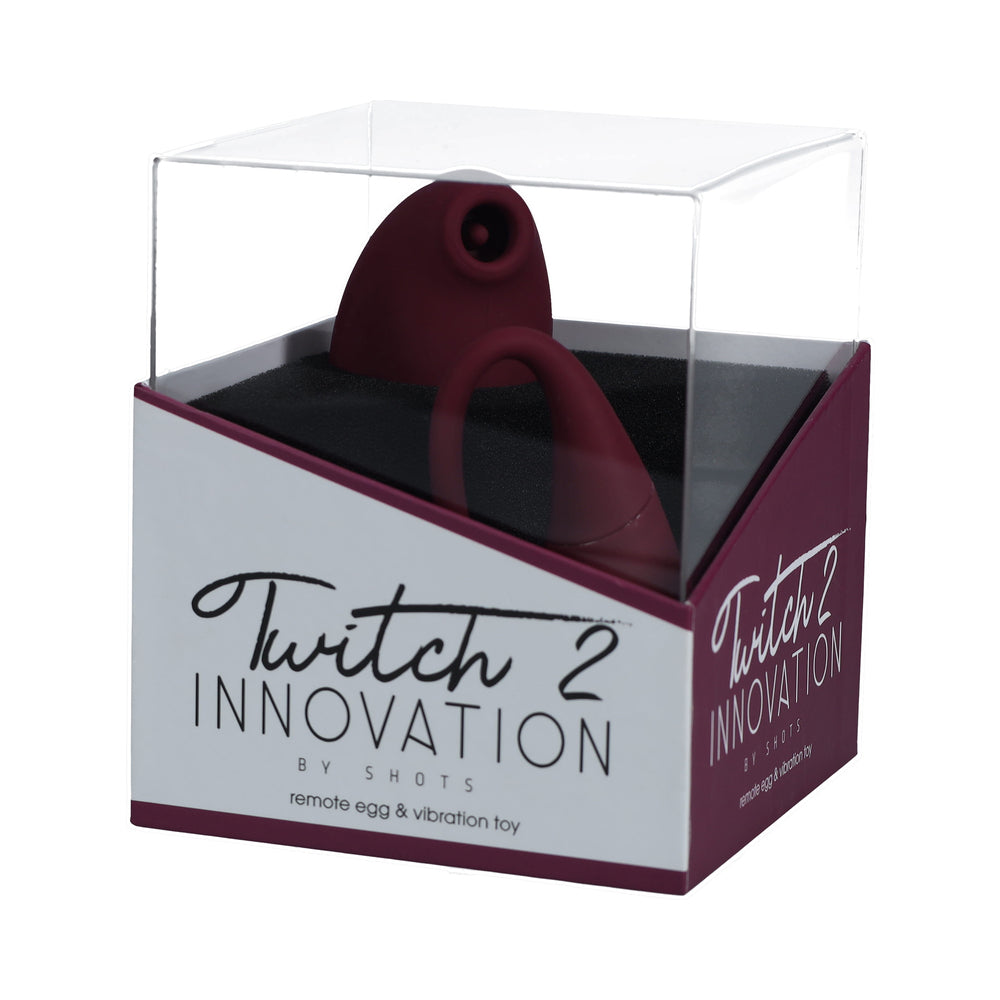Twitch 2 Rechargeable Suction and Flapping Vibrator with Remote Control Vibrating Egg Burgundy burgundy Shots Twitch 2 massager and remote egg in clear display box