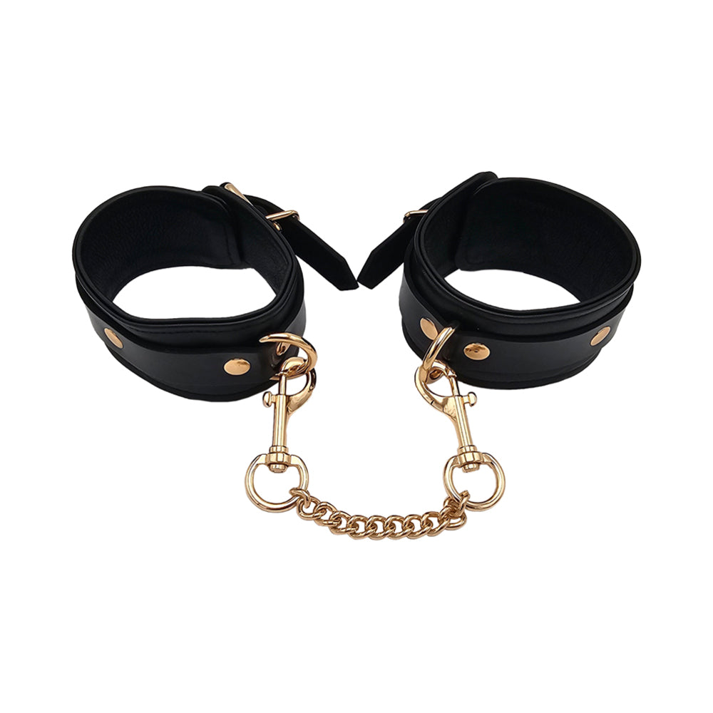 Rouge Leather Plain Wrist Cuffs Black with Gold Accessories Rouge black leather wrist cuffs with gold hardware open circular view with connecting chain