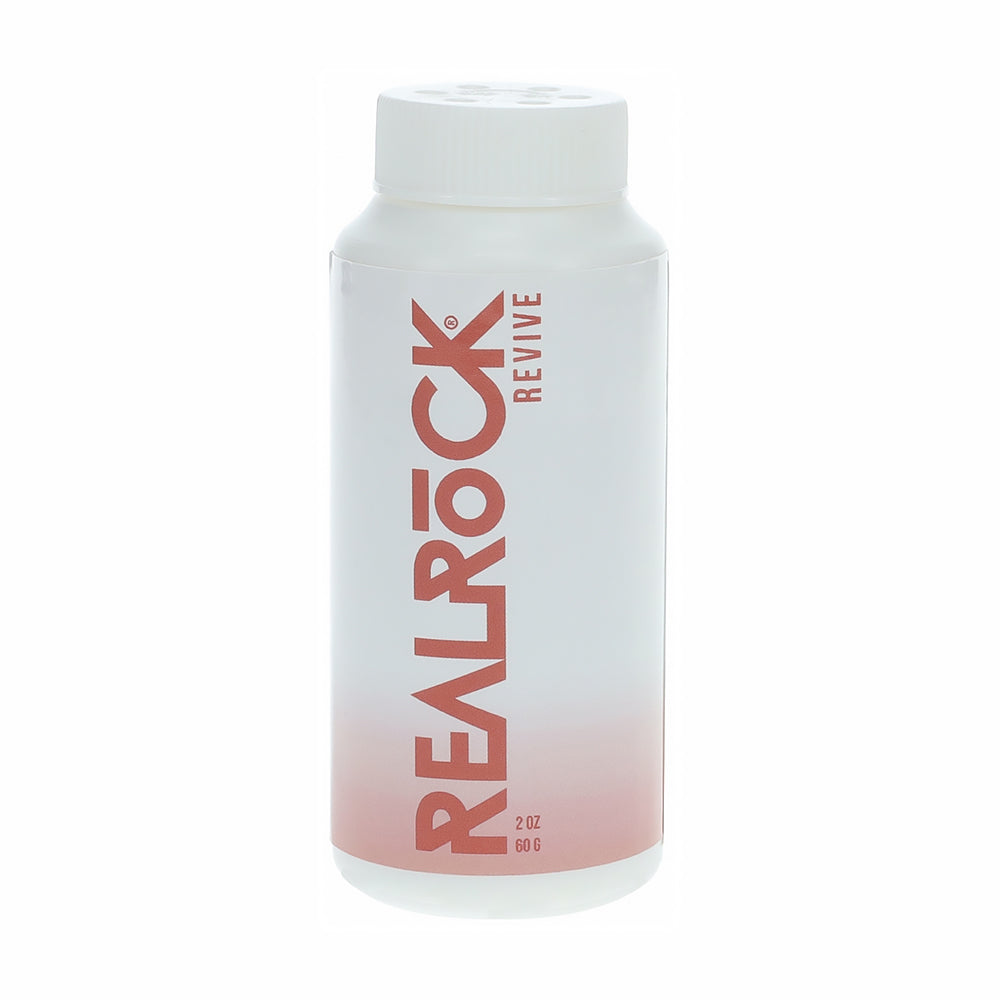 RealRock Revive Reviving Powder 2 oz. white RealRock Revive powder bottle with red vertical logo and white cap