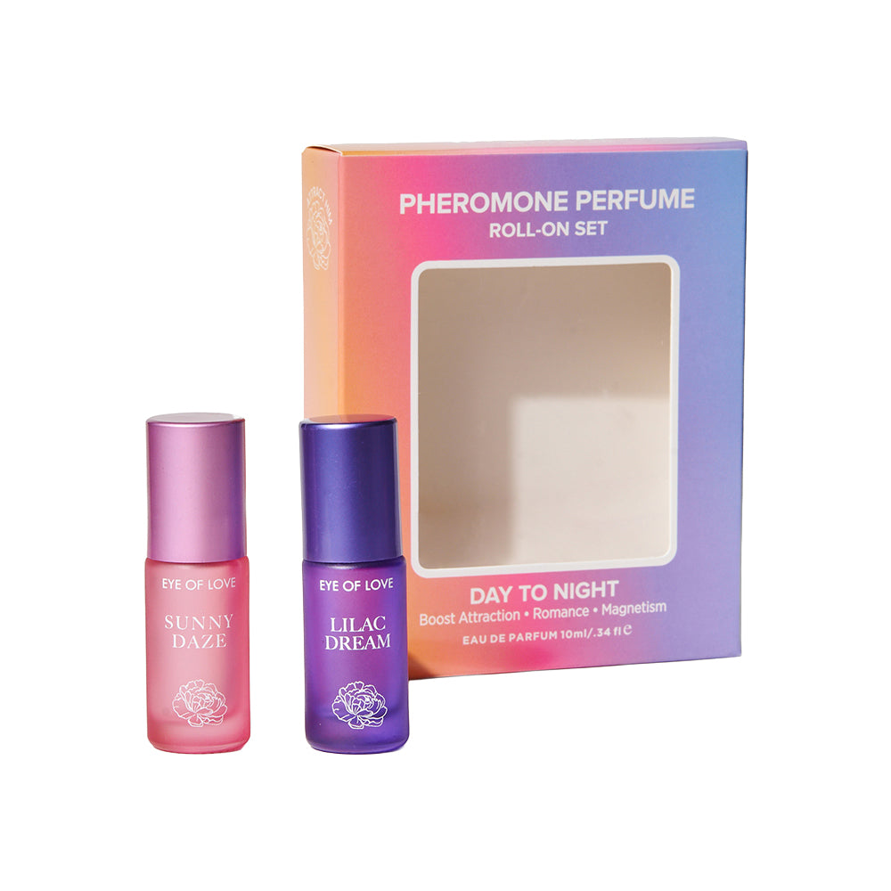 Eye of Love Pheromone Parfum Set 0.34 oz. Roll-On Sunny Daze/Lilac Dream Sunny Daze and Lilac Dream roll-on bottles beside gift box
