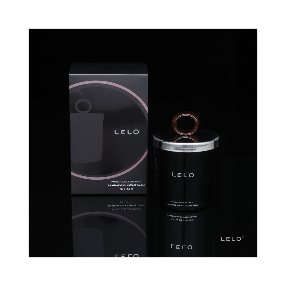 LELO Massage Candle - Black Pepper & Pomegranate Scent LELO massage candle carton beside black jar with ring lid