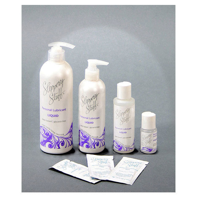 Slippery Stuff Gel Water-Based Lubricant 0.25 oz. Packets Slippery Stuff Gel bottles and 0.25 oz lubricant packets on gray background