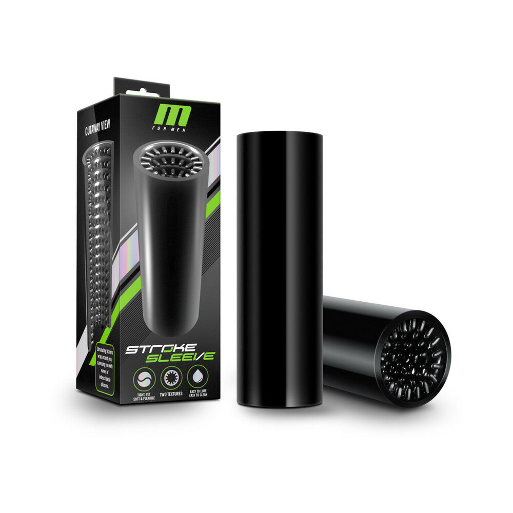 M for Men Stroke Sleeve Reversible Stroker Black Blush M for Men black reversible stroker beside black-and-green retail box with both textured ends visible
