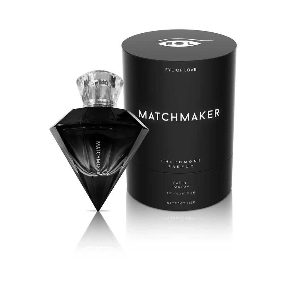 Eye of Love Matchmaker Black Diamond Attract Her Pheromone Parfum 1 oz. black diamond-shaped Attract Her bottle beside cylindrical black box