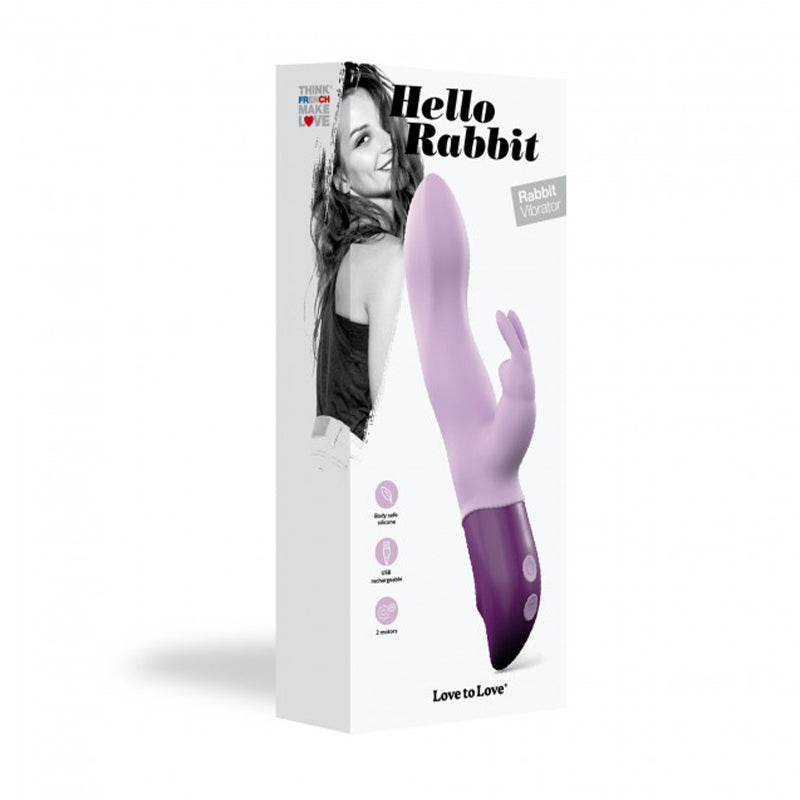 Love to Love Hello Rabbit Rechargeable Rabbit Vibrator Purple Purple Hello Rabbit rechargeable vibrator beside tall white retail box