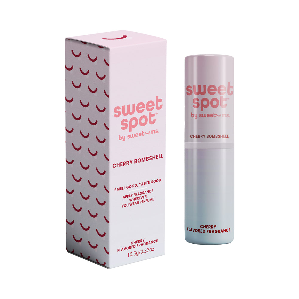 Sweetums Sweet Spot Flavored Fragrance Cherry Bombshell Sweetums Sweet Spot cherry bombshell flavored fragrance displayed as a pink tube beside its retail box