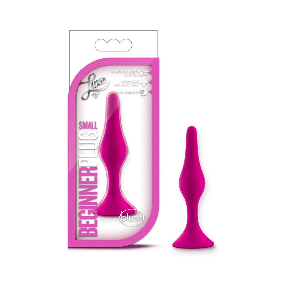 Luxe Silicone Beginner Plug Small Pink Blush Luxe small hot-pink beginner plug beside matching retail package