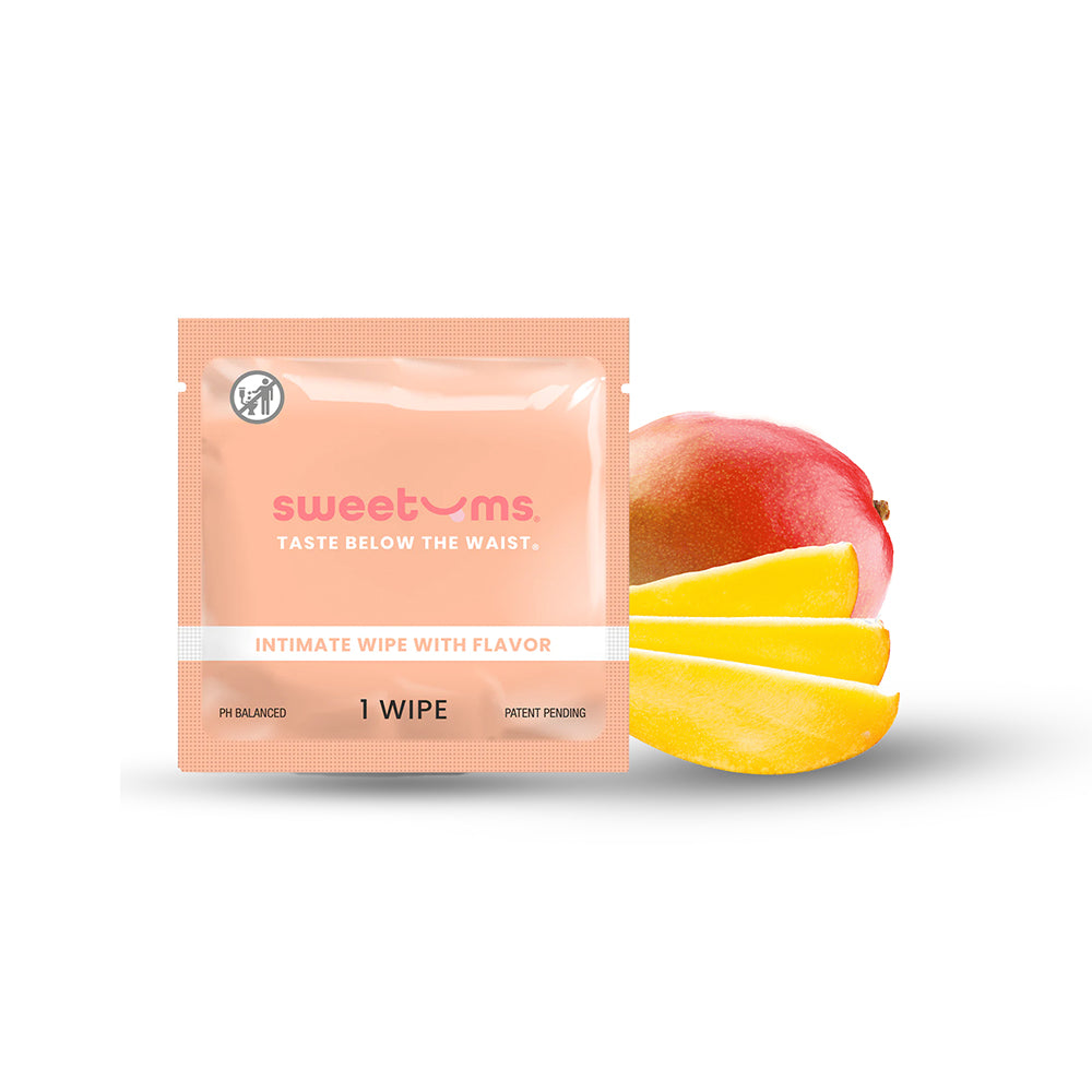 Sweetums Intimate Wipes Mango Individual Peach Sweetums Mango individual wipe packet displayed beside sliced mango