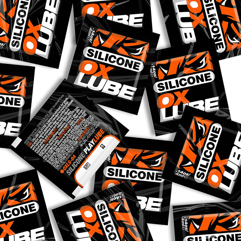 Oxballs THICK Silicone OXLube Singlet 50/Bag scattered black and orange Oxballs Silicone OXLube singlet packets