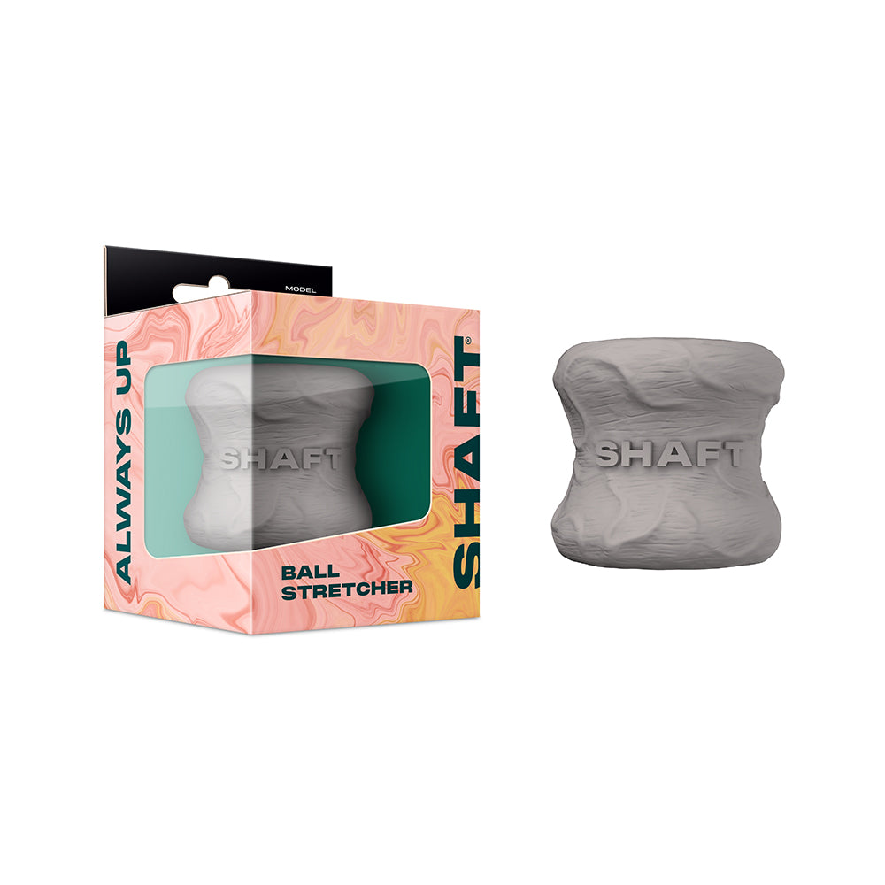 Shaft Model H: Ballstretcher Gray gray Shaft Model H hourglass-shaped ball stretcher beside windowed box