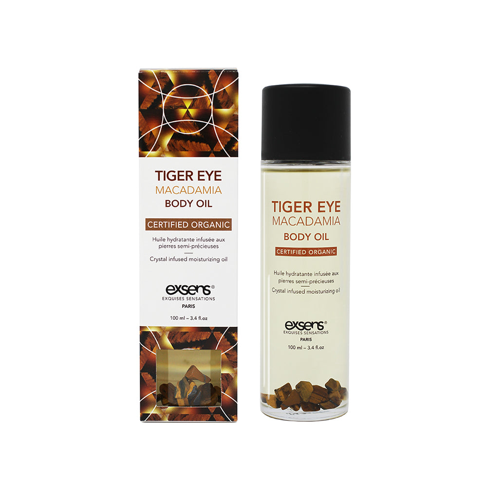 Exsens Body Oil Tiger Eye Macadamia 3.4 oz. Exsens Tiger Eye Macadamia body oil bottle beside matching carton