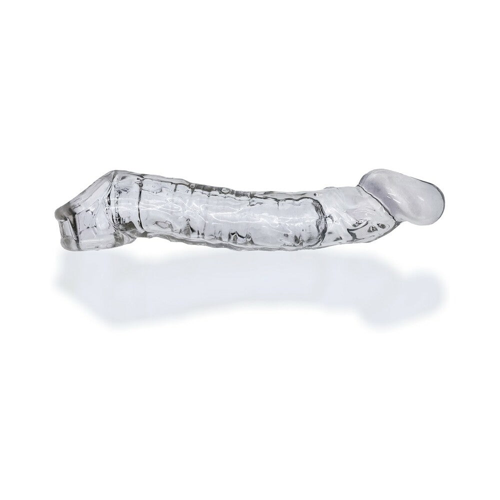 Oxballs Muscle Bandit Slimmest Muscle Cocksheath Clear Side profile of curved clear Muscle Bandit cock sheath